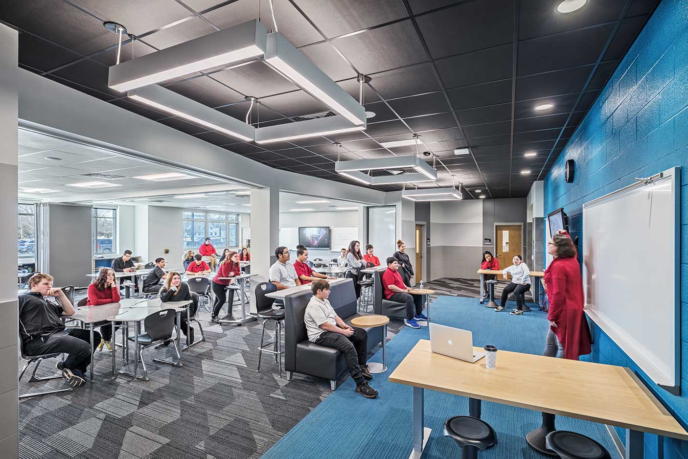 a group of students sitting in a Garmann designed school
