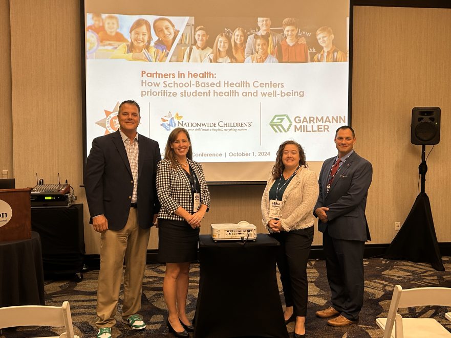 Brian Wolf of Garmann Miller standing in line with Shelby City Schools and Nationwide Childrens representatives