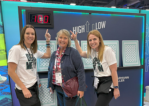 Garmann Miller team at OSBA Capital Conference pointing to High Low game