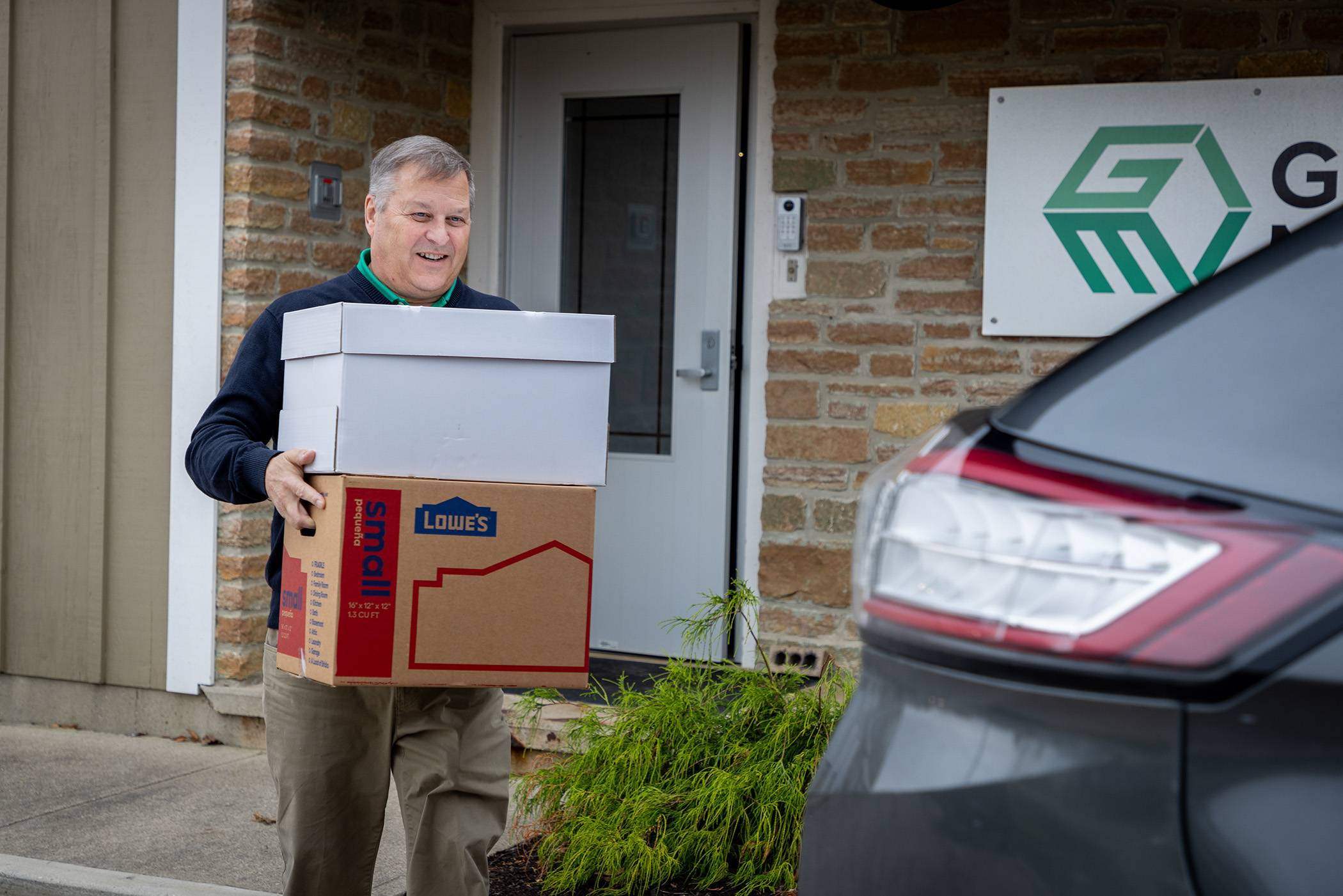 Garmann Miller team member carrying socks for donation to Hannahs Socks