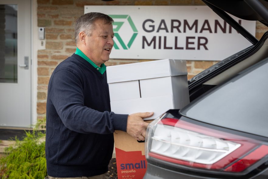 Garmann Miller team member carrying socks for donation to Hannahs Socks