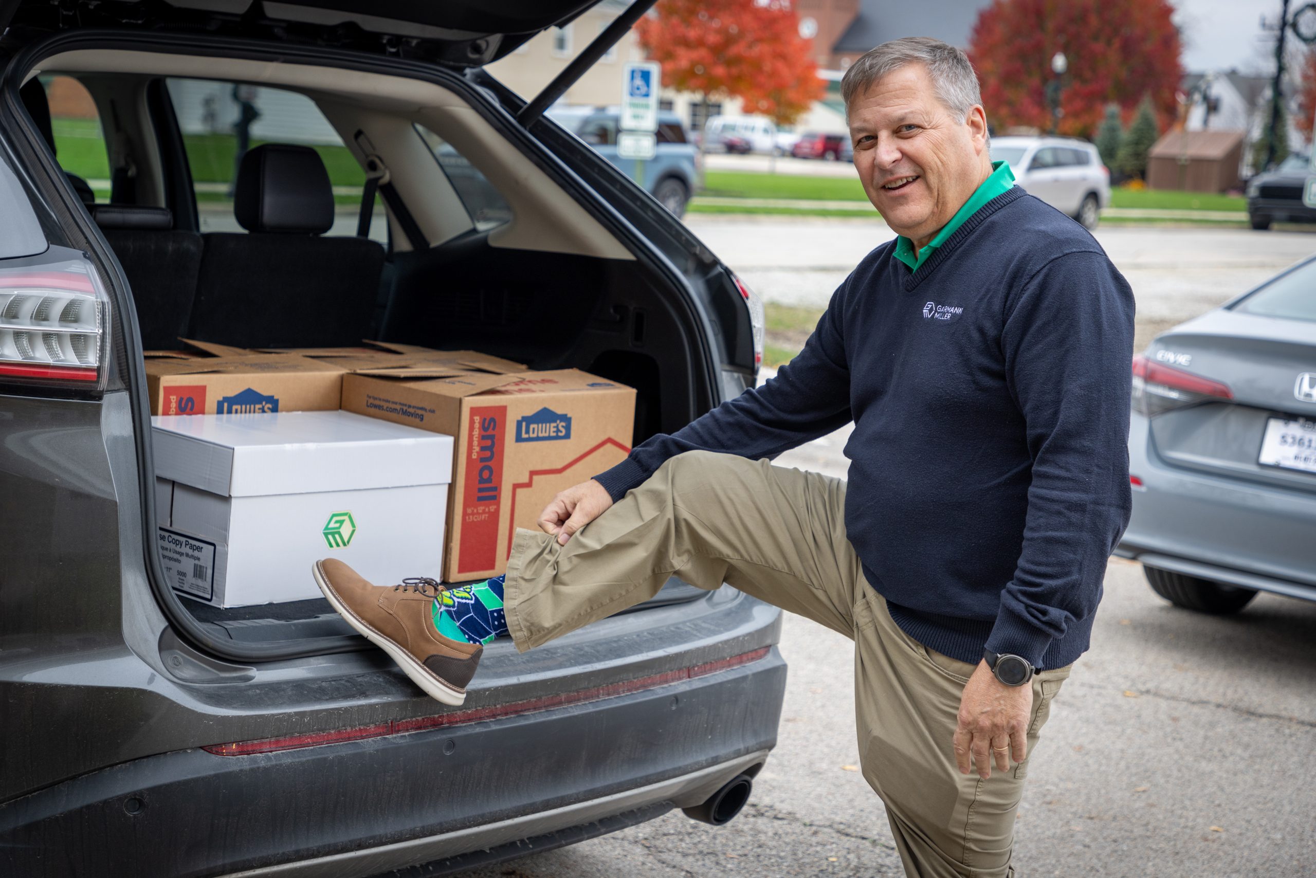 Garmann Miller team member showing off socks